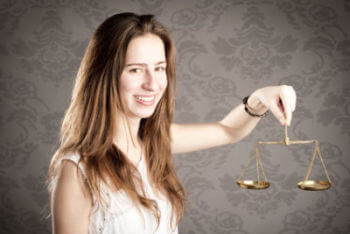 woman holding an hourglass